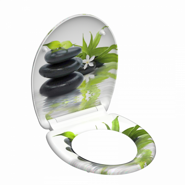 Toilettensitz mit Motiv aus schwarzen Steinen, grünen Blättern und weißer Blüte.