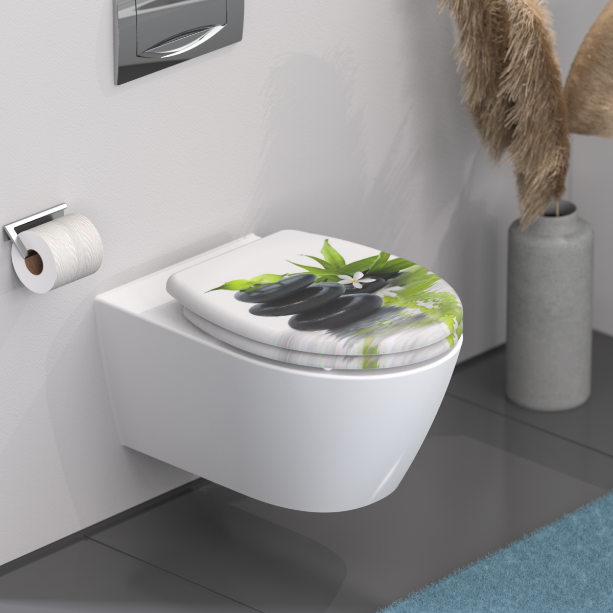 Wandhängendes WC mit Toilettendeckel, Motiv aus schwarzen Steinen und grünen Blättern.