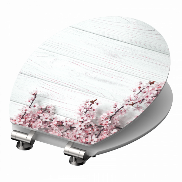 WC-Sitz mit Motiv aus rosa Blütenzweigen auf hellem Holzhintergrund