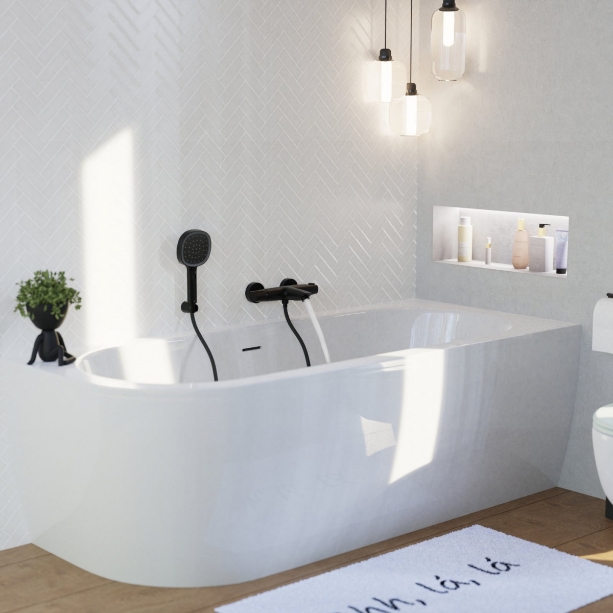 Schwarze Wannenfüllarmatur mit passender Handbrause an einer Badewanne