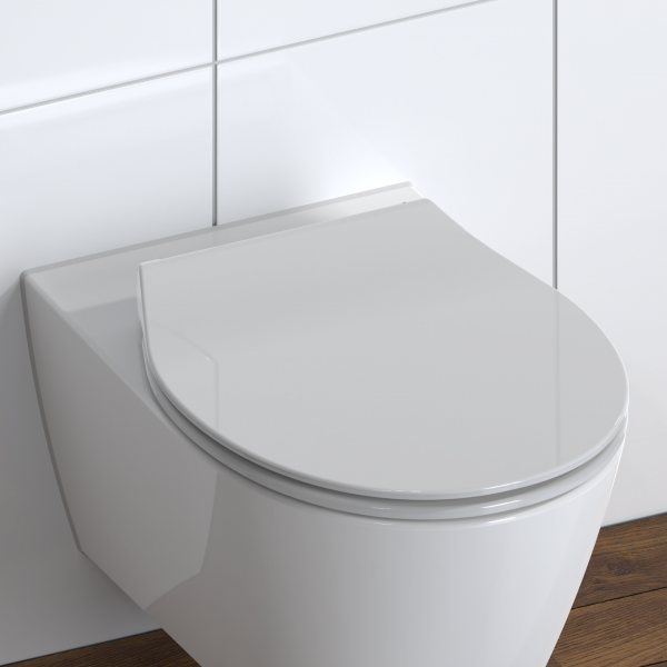 Weiße wandhängende Toilette mit geschlossenem Sitzdeckel vor gefliester Wand.